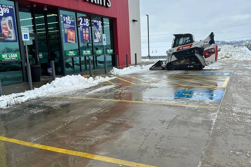 Commercial snow removal at a parking lot
