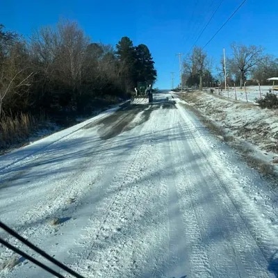 Plowing a snow-covered country road