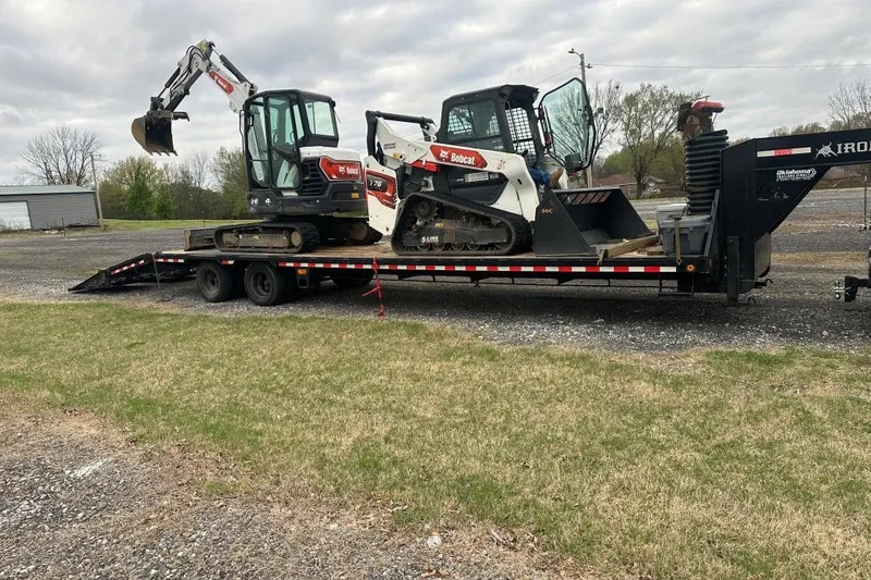 Bobcat excavator and skid steer on a gooseneck trailer